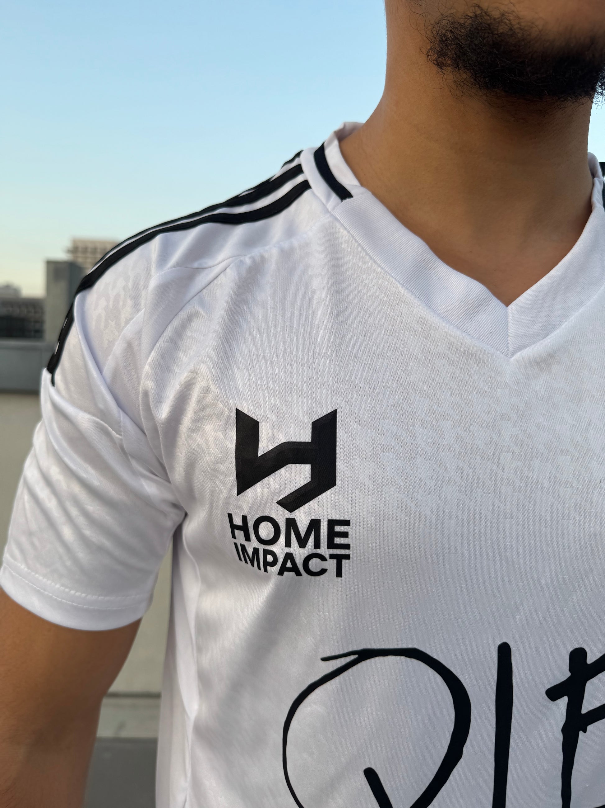 Maillot Home Impact Que La Famille Blanc Noir